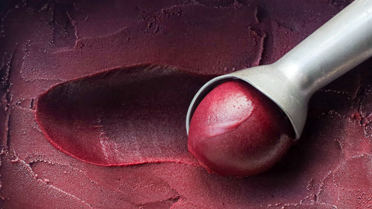 Acai Berry's frozen acai puree being scooped
