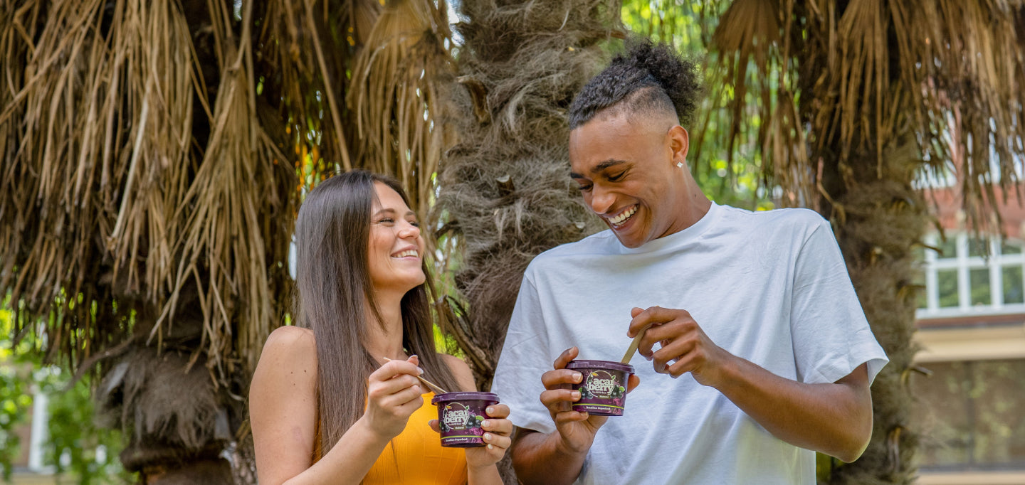 2 people enjoying acai berry pod